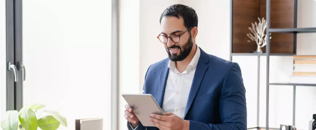 Man in suit on ipad