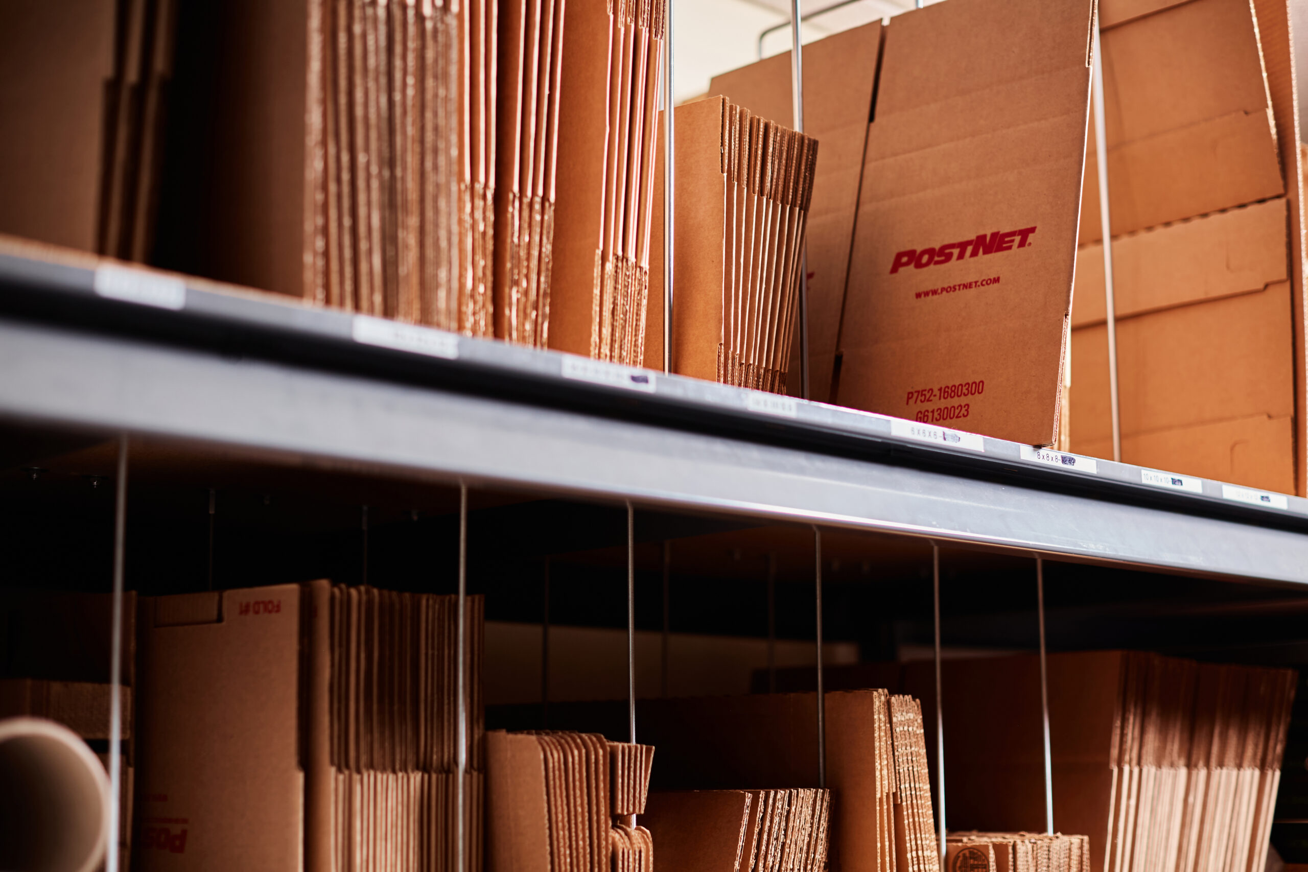 PostNet boxes stacked on a shelf