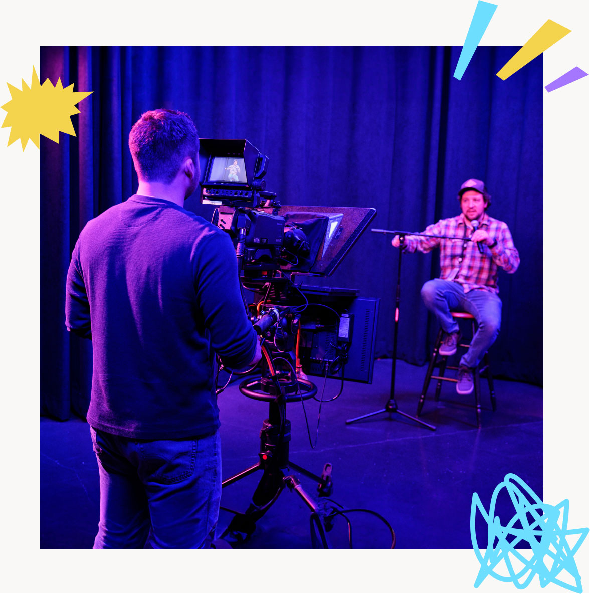 two guys recording a podcast on a microphone with a camera